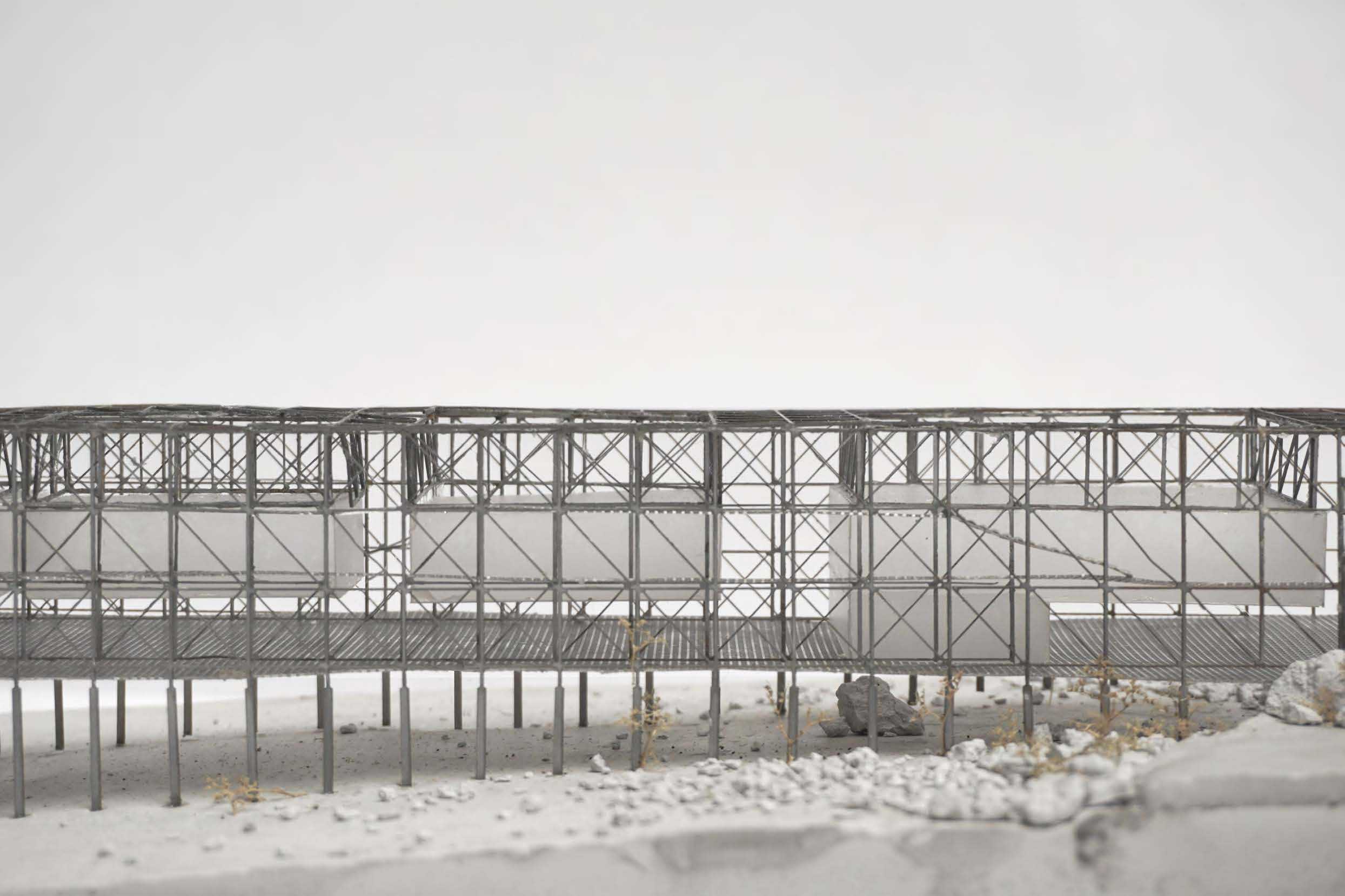 Close-up 1:200 model view that reveals its steel, polycarbonate and plaster material qualities.