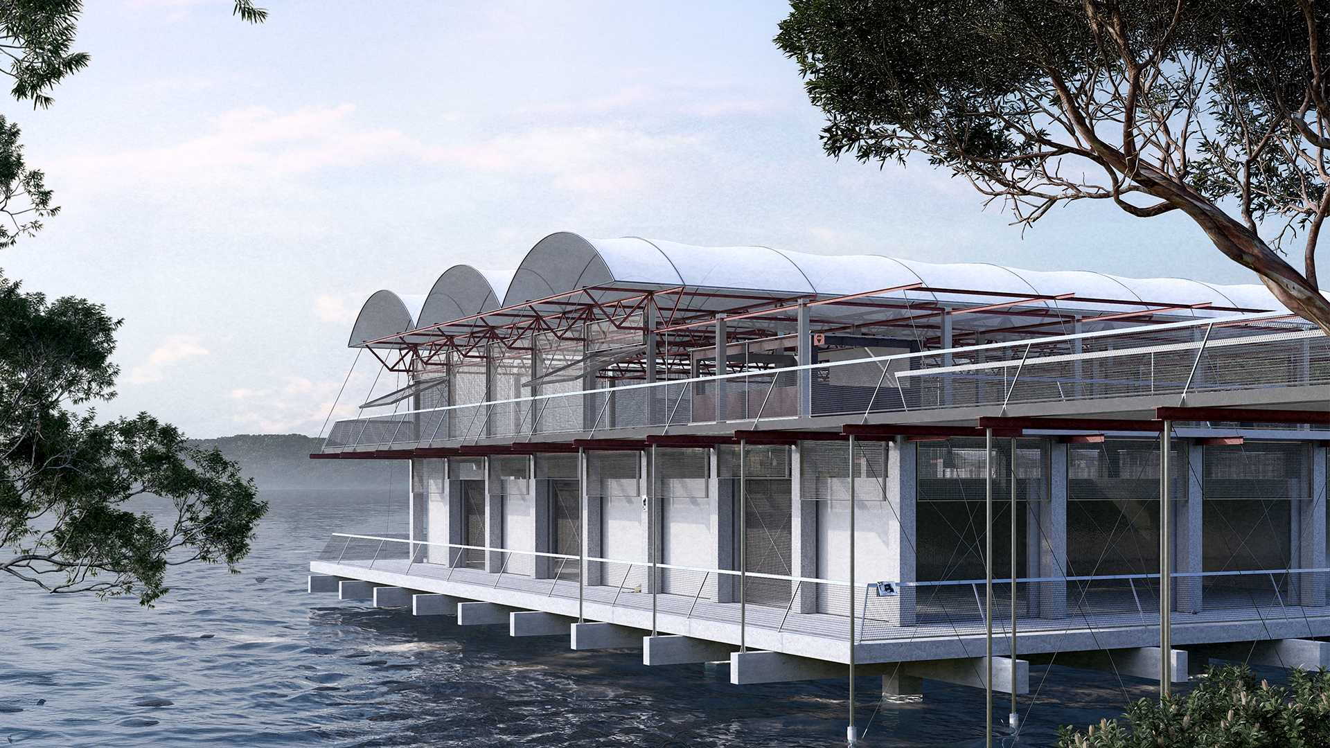 The theatre hovers over the shallow waters of Berrys Bay with a solid concrete base holding up light steel framing.