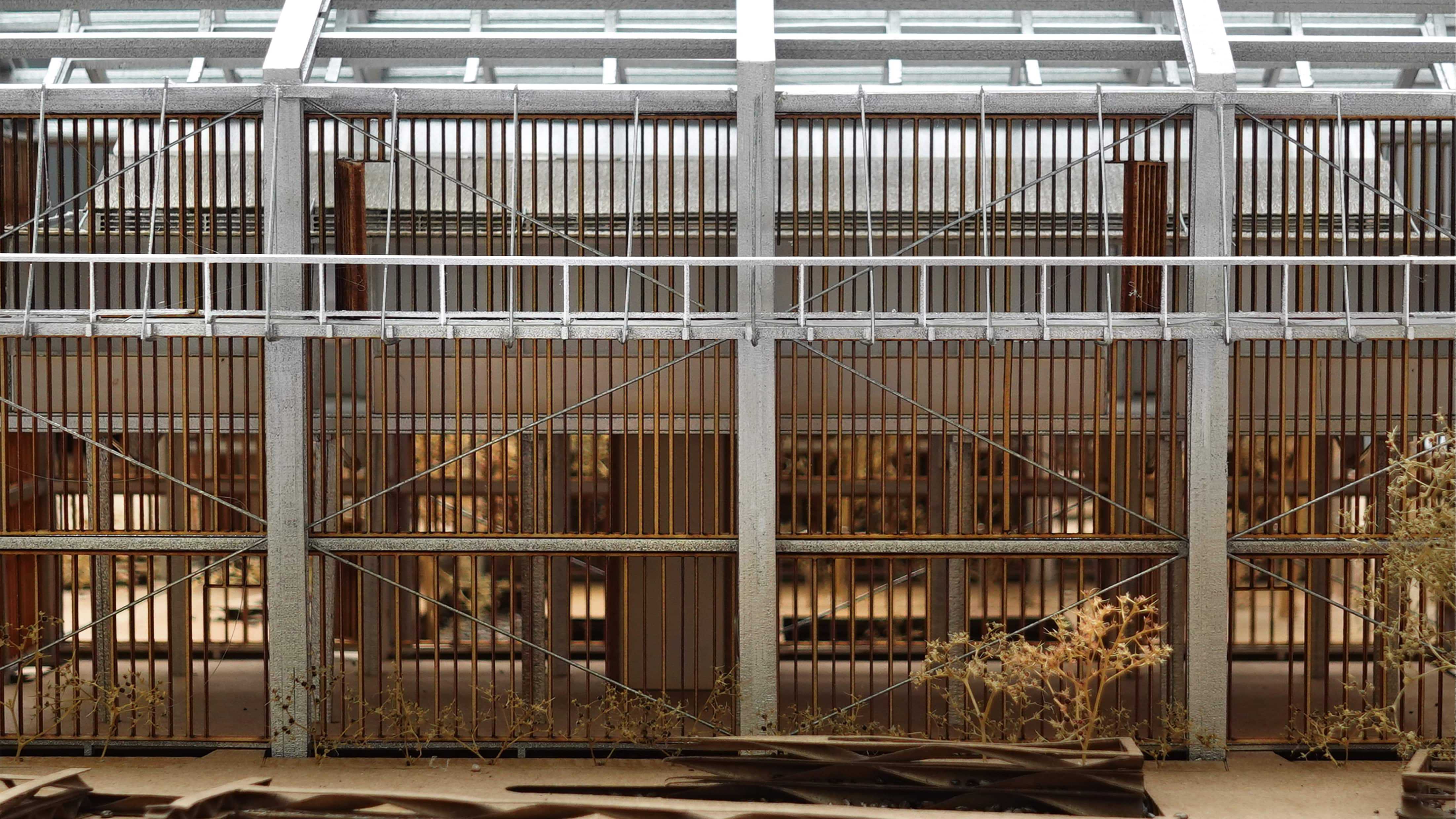 A 1:100 scale model of the façade features louvers crafted from recycled timber