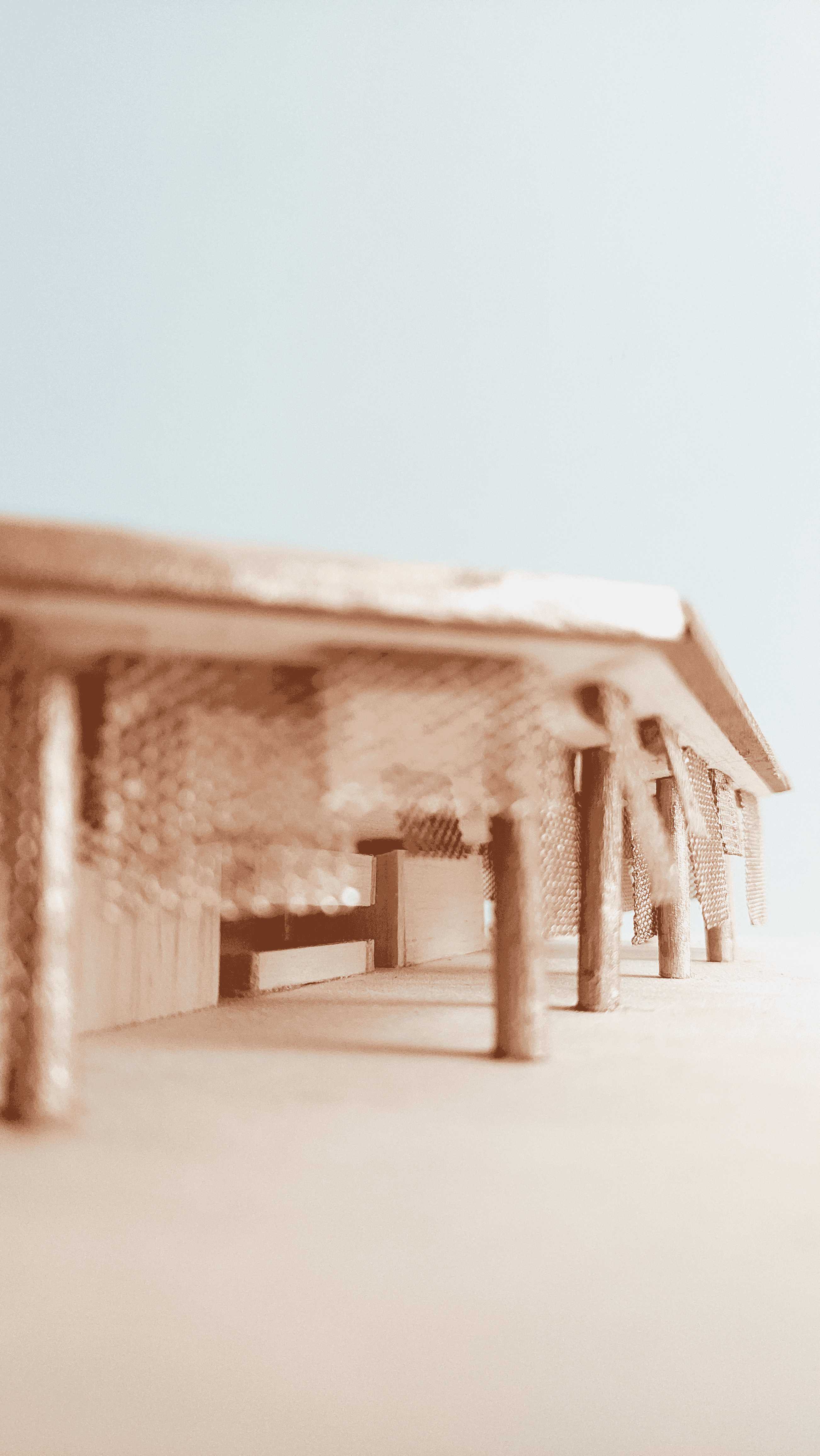 Perforated copper panels veil parts of the theatre, and as the wind blows, the panels flutter, momentarily unveiling the building beneath.