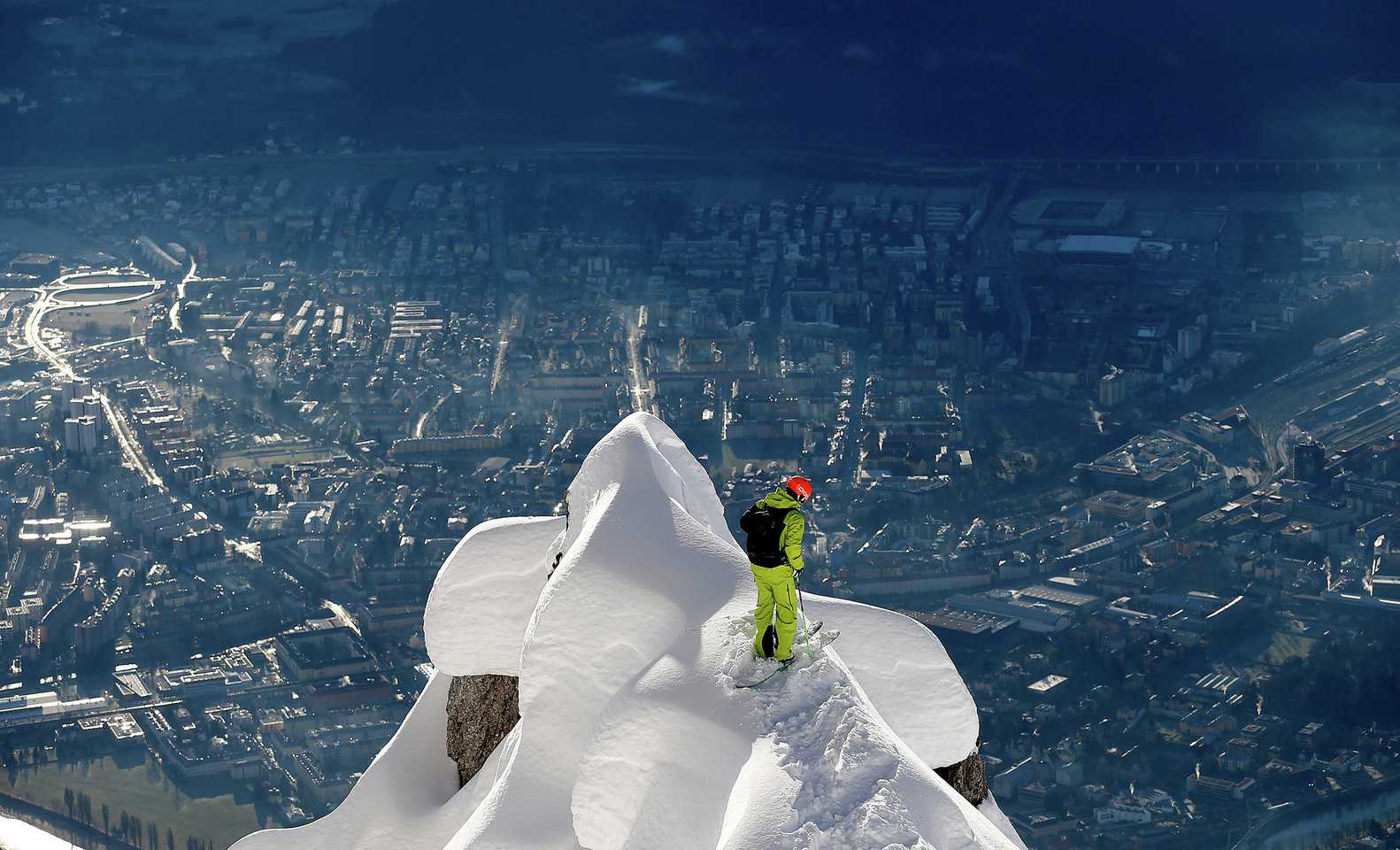 Freeskier overlooking Innsbruck from the Nordkette (Source: Skiline)